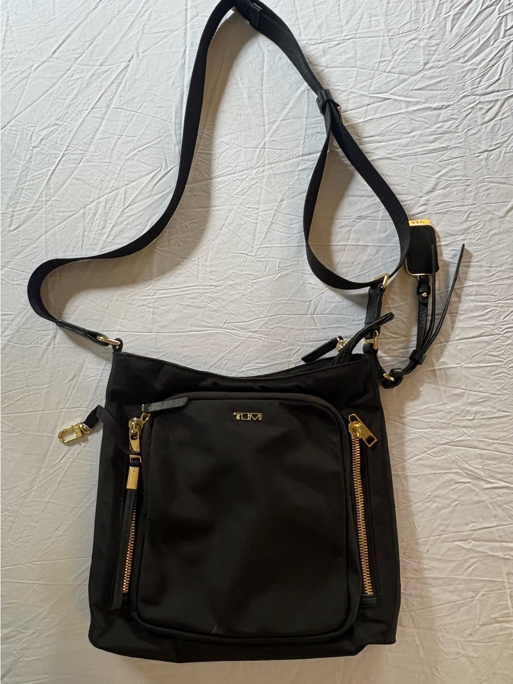 Tumi Black Crossbody Bag with Gold Accents